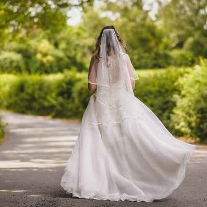 A cascade cut satin edge veil