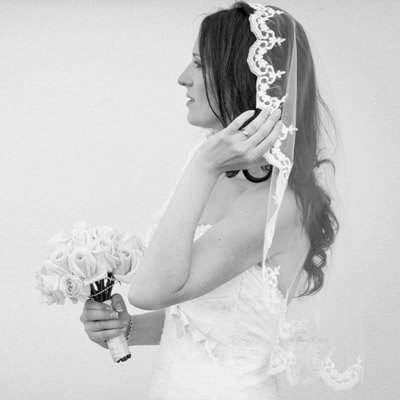 A short waist length lace mantilla wedding veil